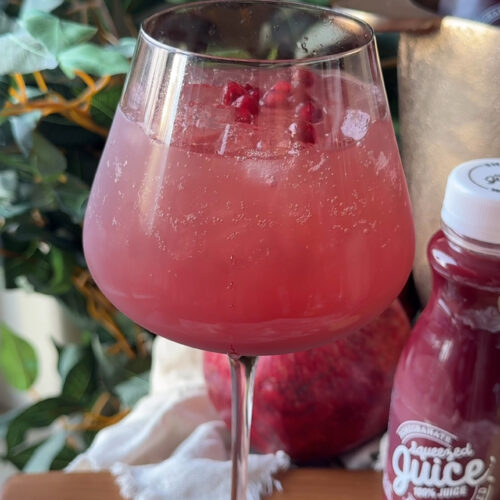 Non-alcoholic sparkling pomegranate paloma mocktail