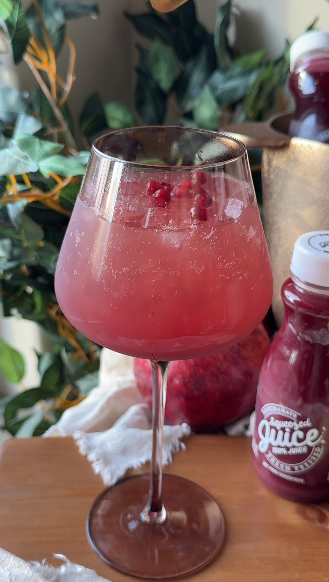 Non-alcoholic sparkling pomegranate paloma mocktail